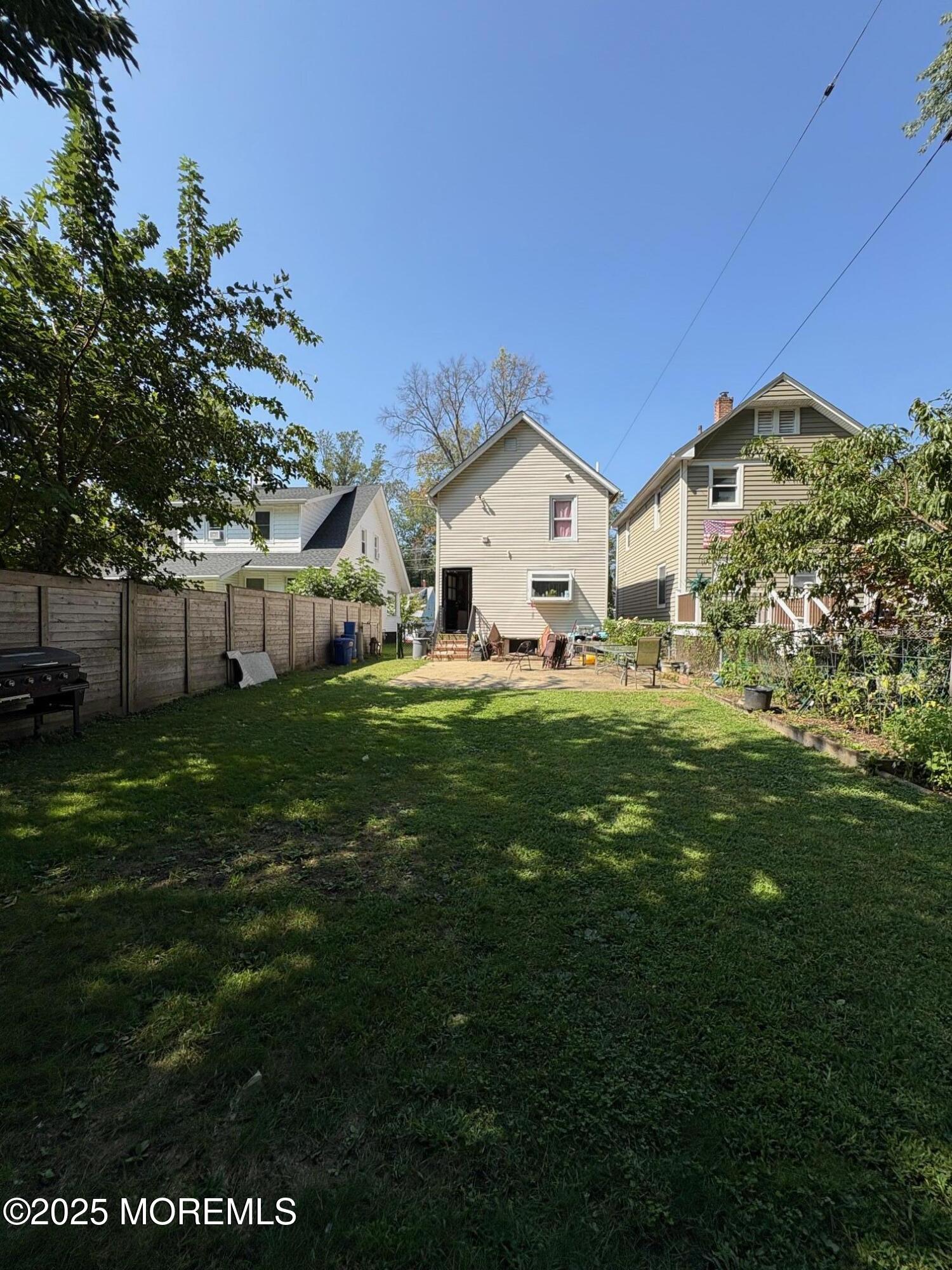 80 Jackson Street Freehold, NJ 07728 - Photo 2 of 21 a front view of a house with a yard