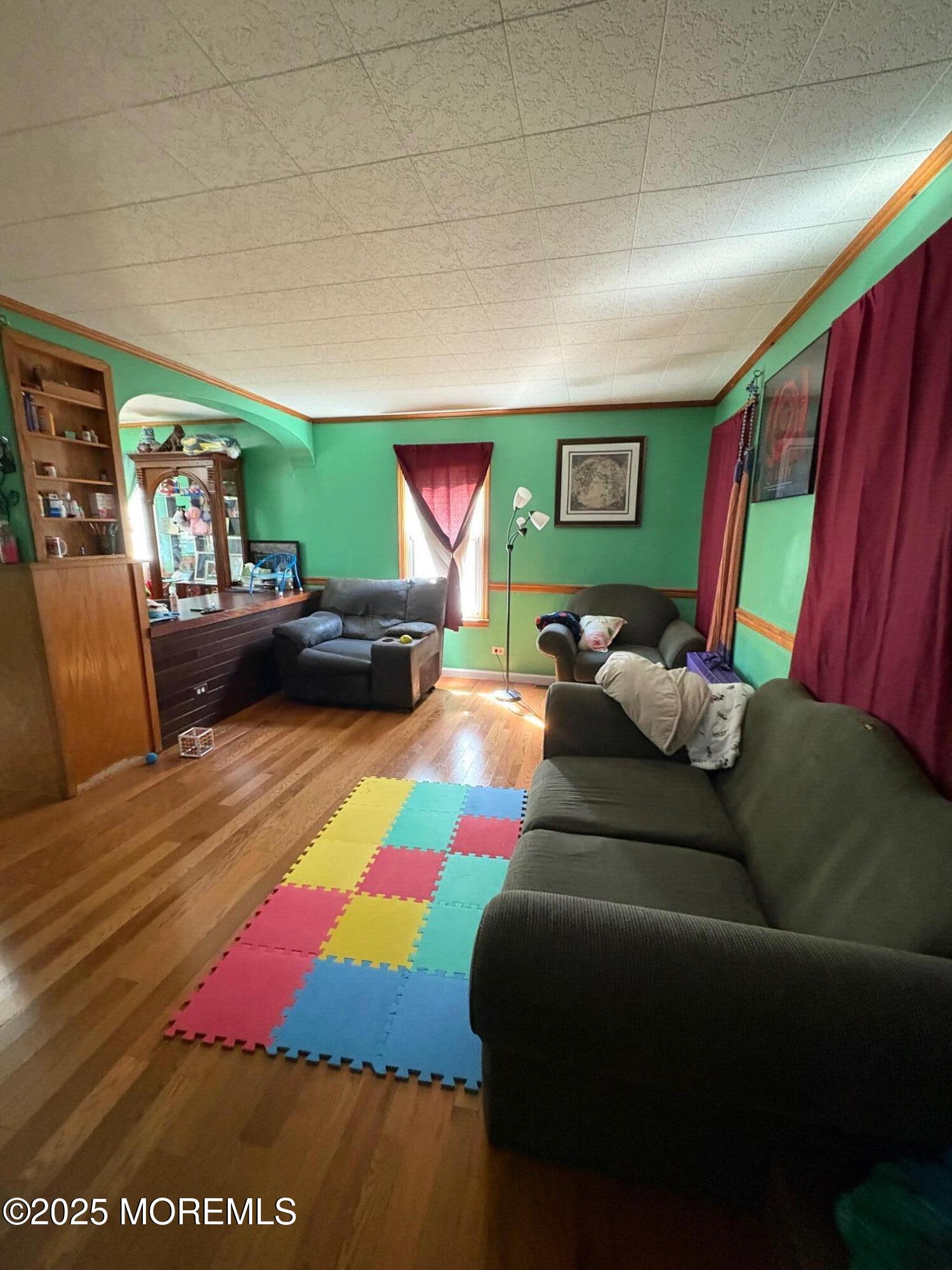 80 Jackson Street Freehold, NJ 07728 - Photo 8 of 21 a living room with furniture and a flat screen tv