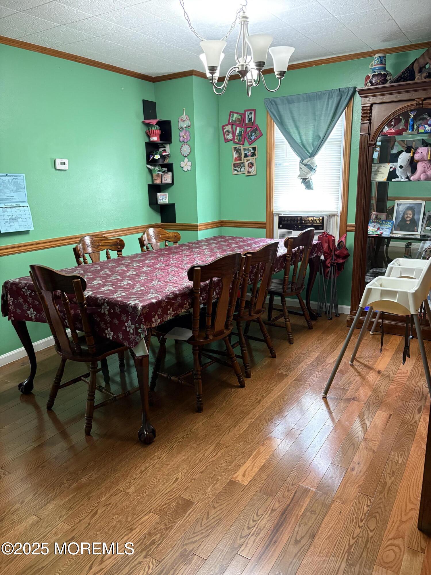 80 Jackson Street Freehold, NJ 07728 - Photo 10 of 21 a view of a dining area with furniture and chandelier