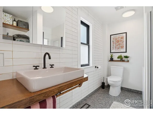 a view of living room kitchen with furniture and wooden floor