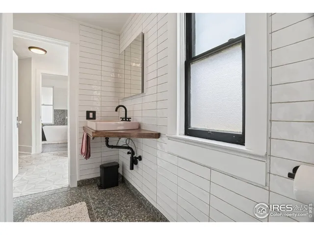 a view of a backyard with sitting area