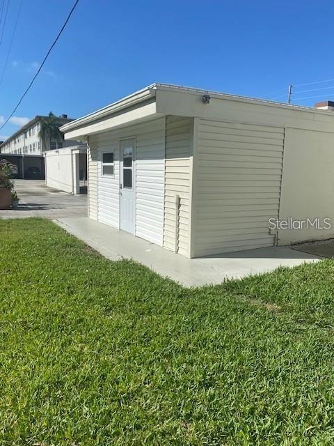 4565 Duhme Road, Unit 110 St. Petersburg, FL 33708 - Photo 11 of 13 a front view of a house with a yard