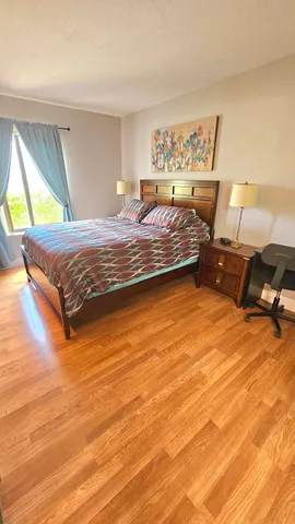 a bedroom with a bed and a dresser
