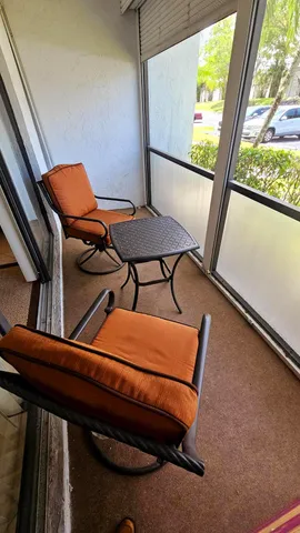 a blue chair sitting in front of a window