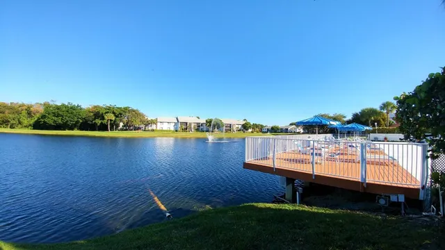 a view of a lake with houses and a yard
