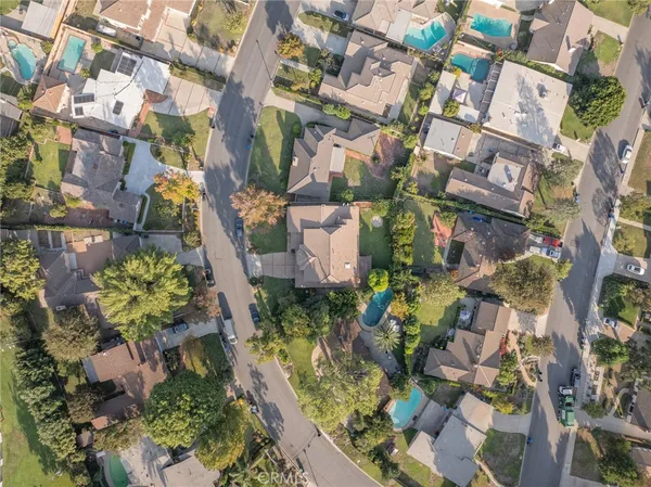 an aerial view of residential houses with outdoor space