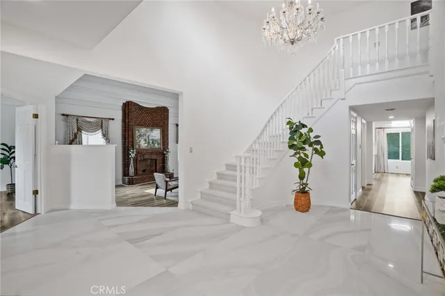 a view of an entryway with wooden floor