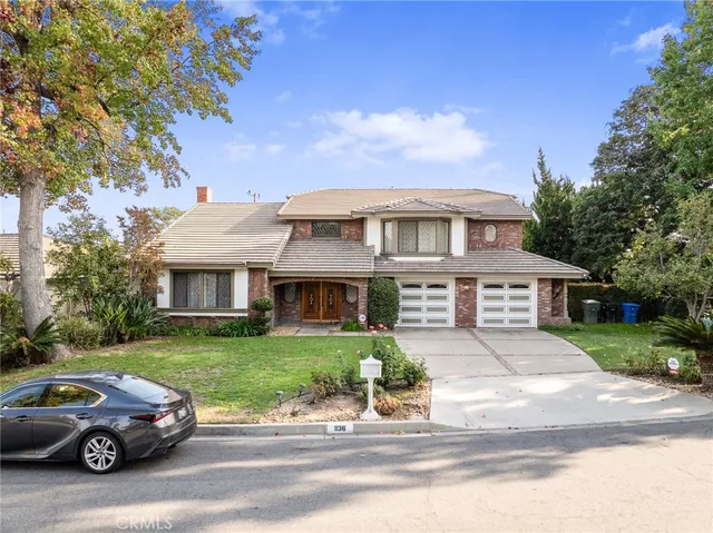 a view of a car parked in front of a house