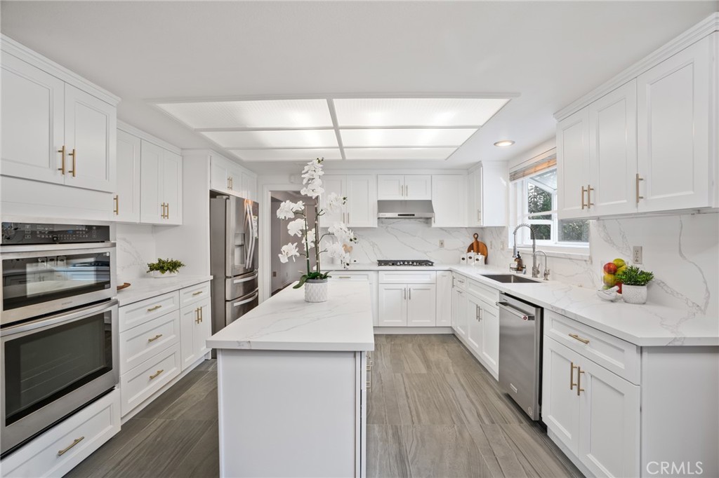 1136 Columbia Road Arcadia, CA 91007 - Photo 26 of 50 a kitchen with white cabinets and appliances