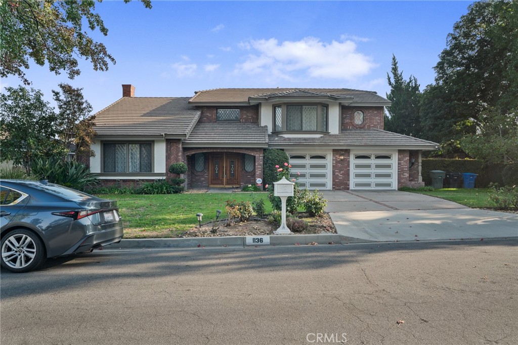1136 Columbia Road Arcadia, CA 91007 - Photo 3 of 50 a front view of a house with a garden and plants