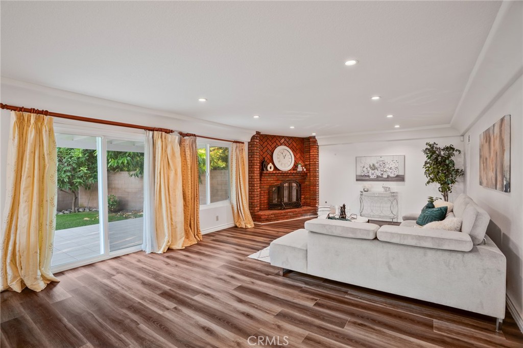 1136 Columbia Road Arcadia, CA 91007 - Photo 33 of 50 a living room with furniture a fireplace and a large window