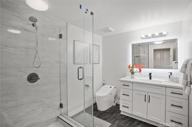 a view of a room with wooden floor and natural light