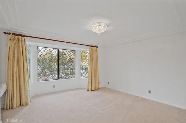a spacious bathroom with double vanity and a mirror