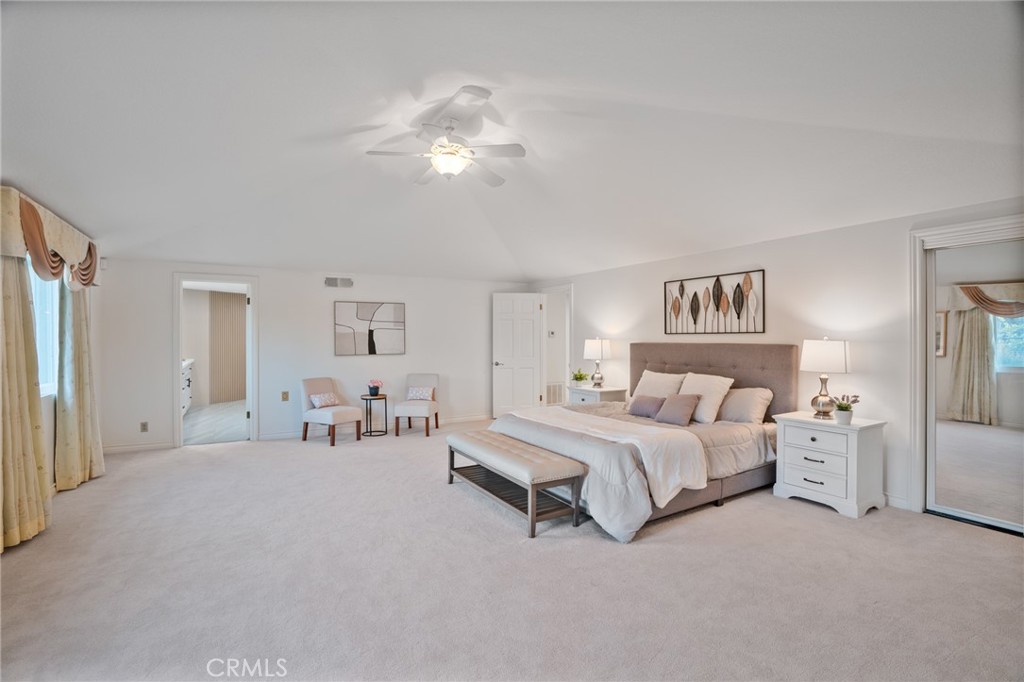 1136 Columbia Road Arcadia, CA 91007 - Photo 44 of 50 a spacious bedroom with a bed and a chandelier