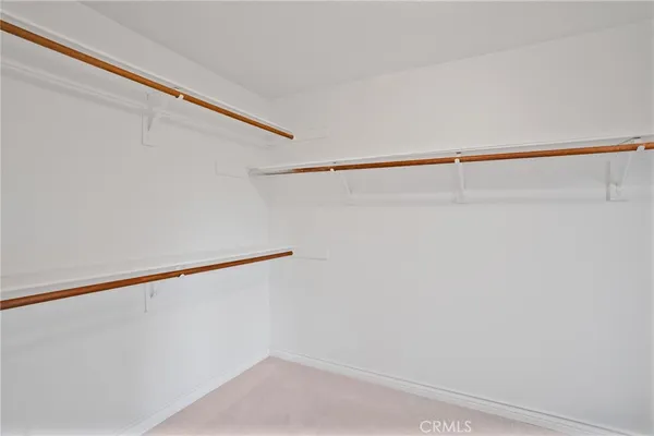a en suite bathroom with double sink and a mirror