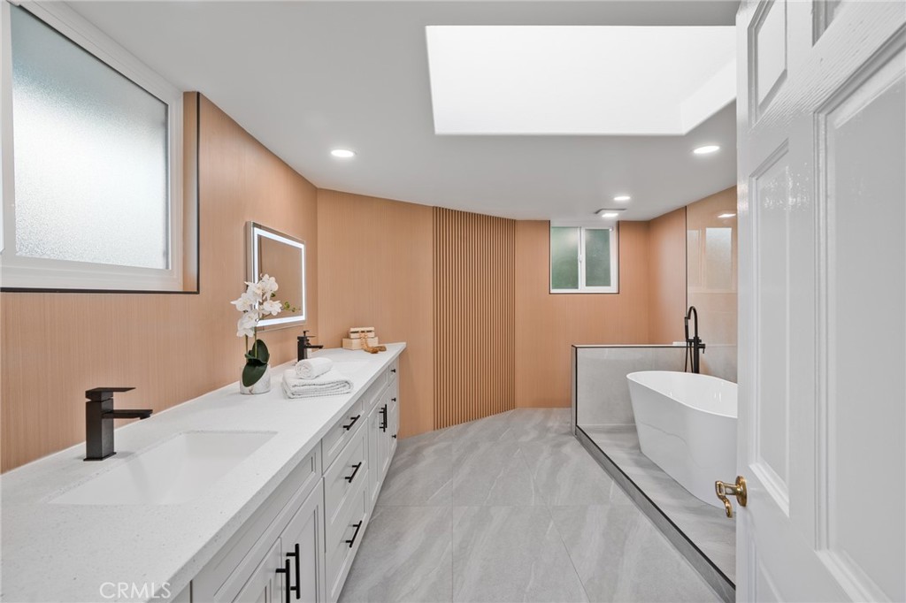 1136 Columbia Road Arcadia, CA 91007 - Photo 49 of 50 a bathroom with a double vanity sink a mirror and a bathtub