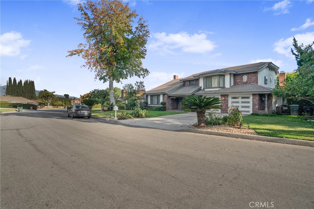 1136 Columbia Road Arcadia, CA 91007 - Photo 7 of 50 a front view of a house with a yard and a street