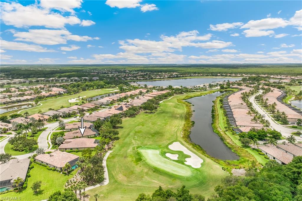 12449 Lockford Lane Naples, FL 34120 - Photo 32 of 45 a view of an ocean and a building