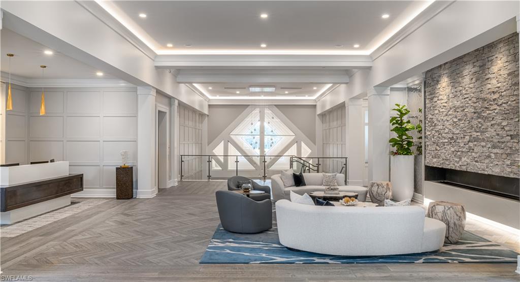 12449 Lockford Lane Naples, FL 34120 - Photo 34 of 45 a living room with furniture and a large window