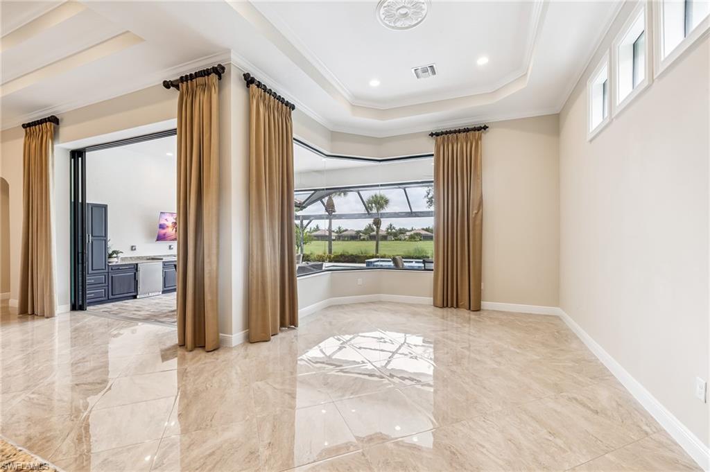 12449 Lockford Lane Naples, FL 34120 - Photo 10 of 45 a view of a room with a large window
