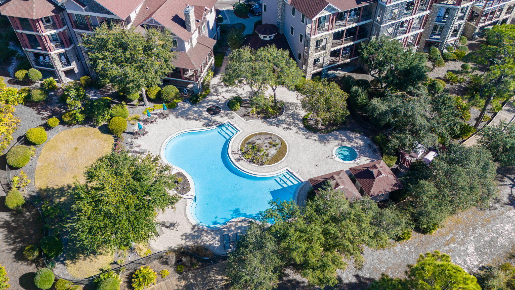 1406 Southern Point Court, Unit BXII23 Panama City Beach, FL 32413 - Photo 12 of 28 a backyard of a house with a yard and outdoor seating