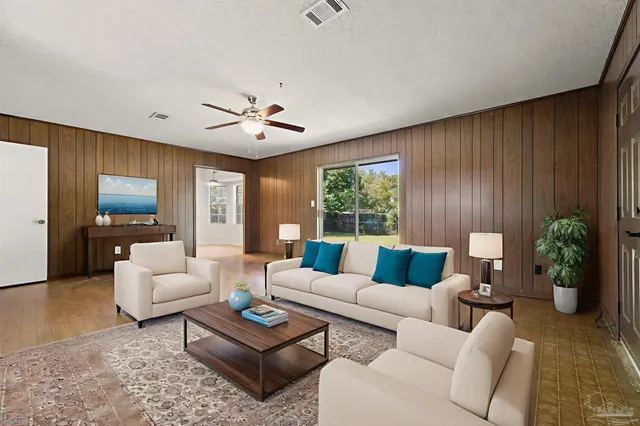 a spacious bedroom with a bed and a couch