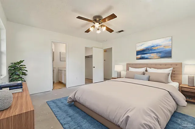 a bathroom with a sink a toilet and vanity