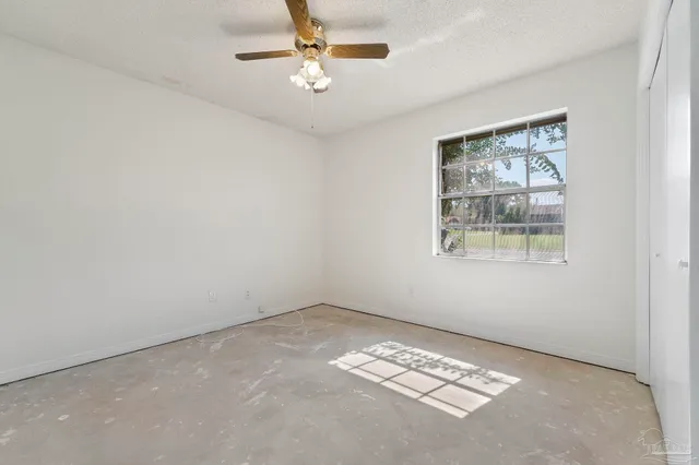 a view of a house with swimming pool and a yard