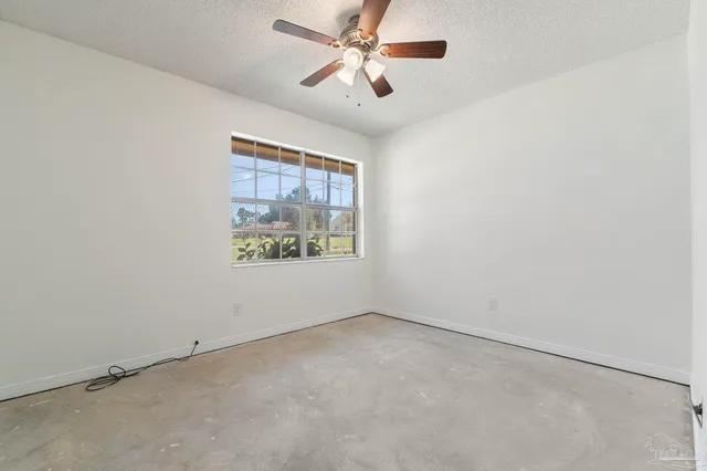 an aerial view of a house with swimming pool patio and lake view