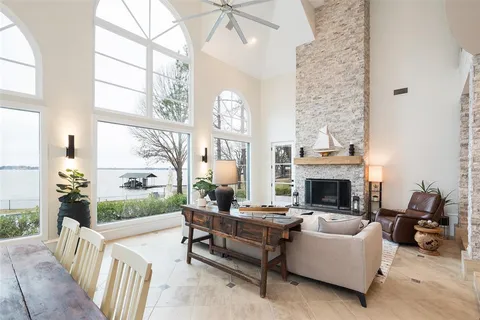 a living room with furniture and a view of kitchen