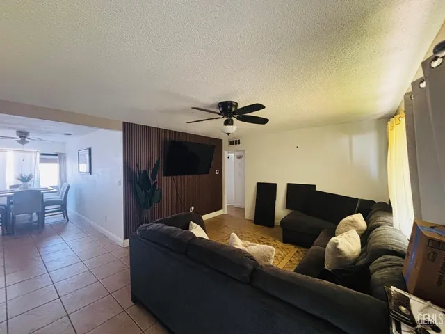 a bedroom with a bed and a mirror