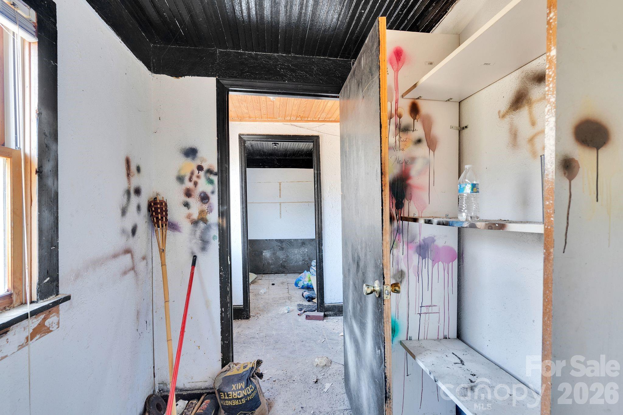 4521 Edgeland Road Edgemoor, SC 29712 - Photo 21 of 48 a view of walk in closet with clothes and shoes