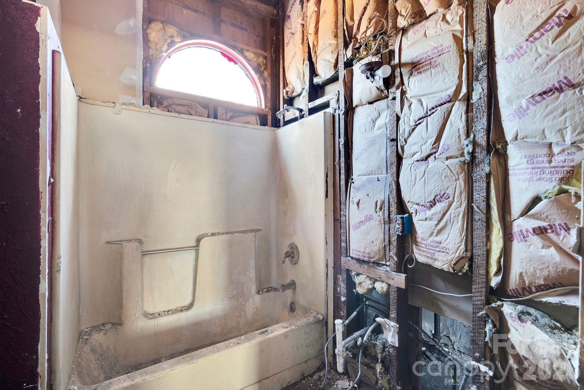 4521 Edgeland Road Edgemoor, SC 29712 - Photo 24 of 48 a bathroom with a bathtub and shower
