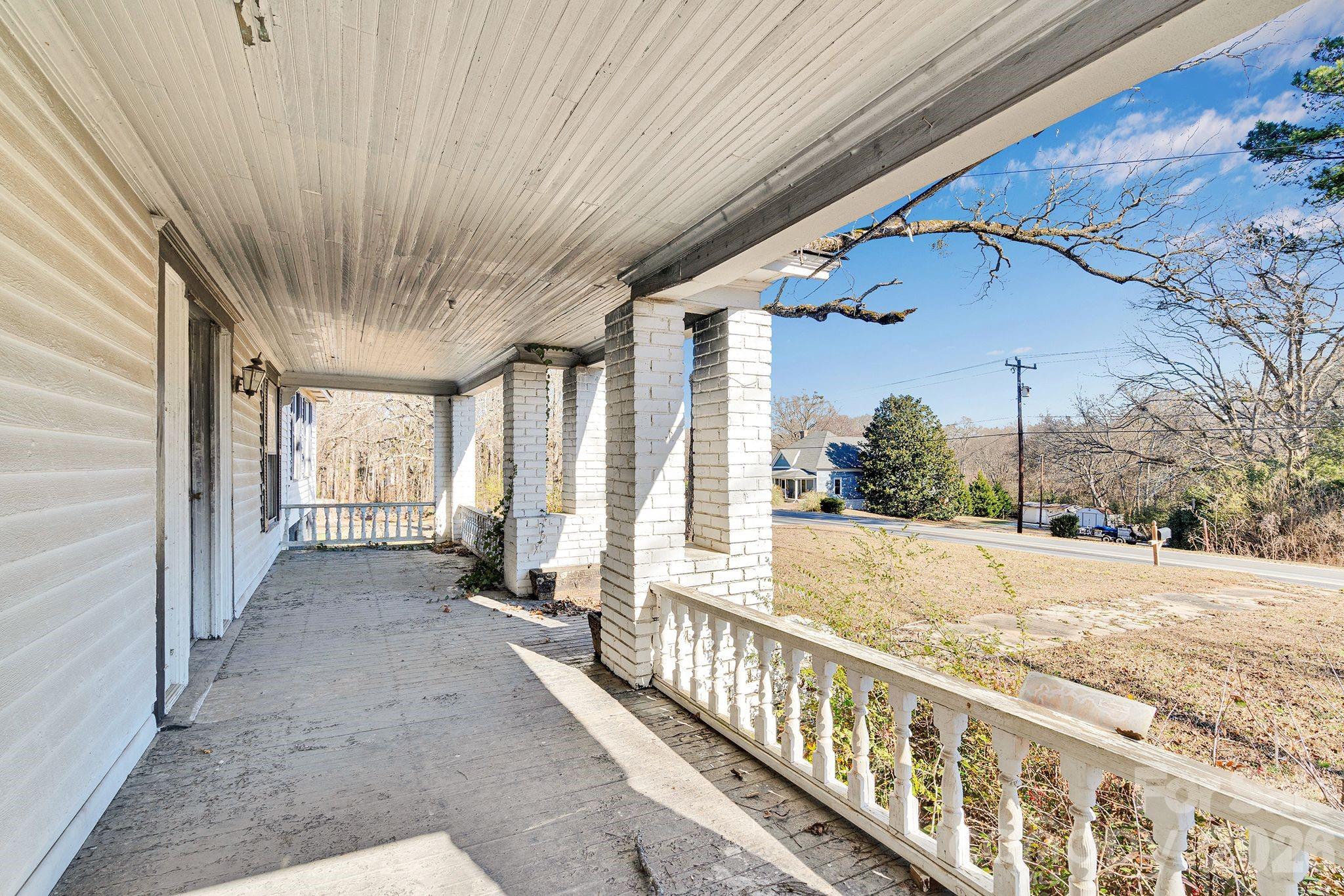 4521 Edgeland Road Edgemoor, SC 29712 - Photo 38 of 48 a view of a porch with wooden floor and fence