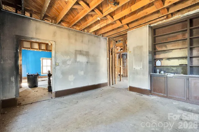 a view of an empty room with a fireplace