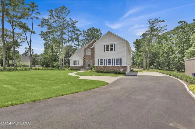 a view of house with outdoor space and garden