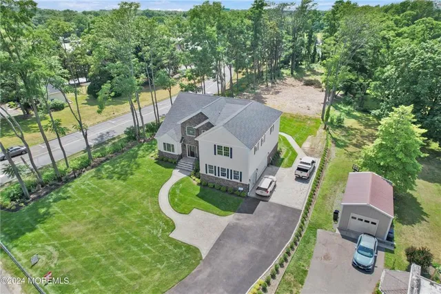 an aerial view of a house with a garden