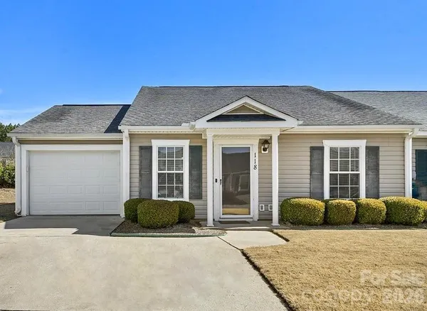 a front view of a house with a garage