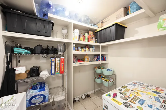 a room with a book shelf and a wooden floor