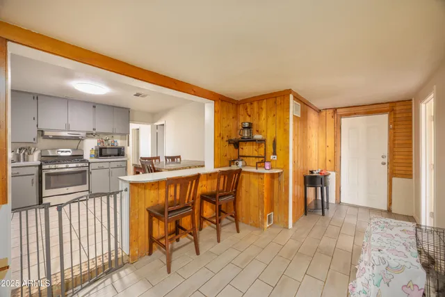 a kitchen with stainless steel appliances a refrigerator and cabinets