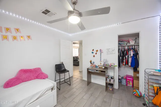 a bedroom with furniture and a window