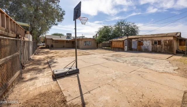 a front view of a house with trees