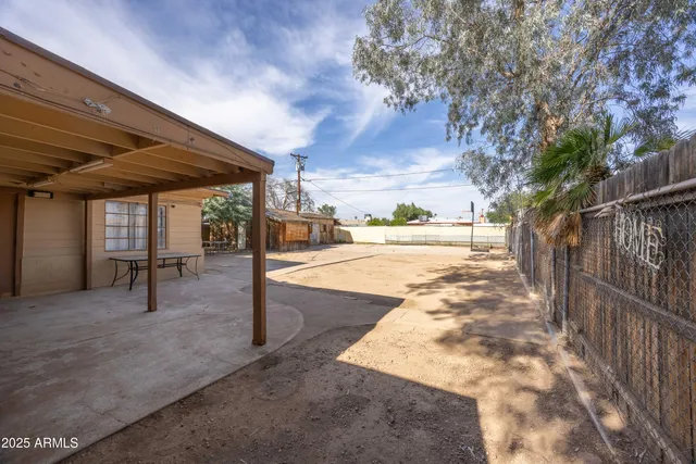 a view of a backyard of the house
