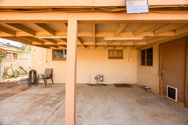 a view of a room with table and chairs
