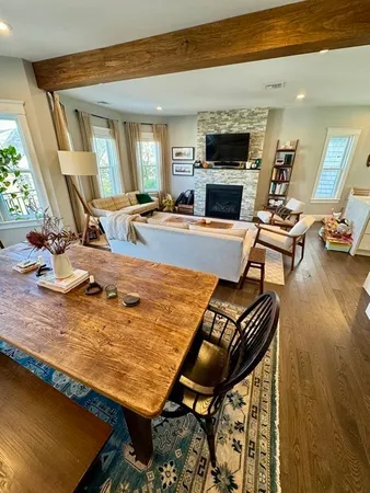 a living room with furniture fireplace and a flat screen tv