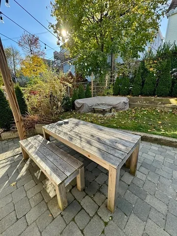 a view of a wooden floor with a table and chairs