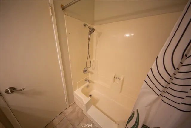 a bathroom with a shower and a toilet