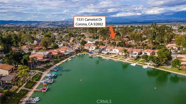 a view of swimming pool with lounge chair and potted plants