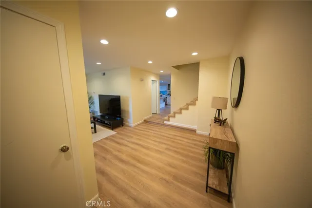 a room with a bed and a flat screen tv