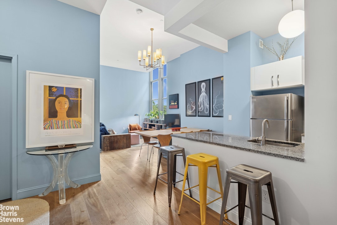 220 West 148th Street, Unit 4B Manhattan, NY 10039 - Photo 2 of 15 a view of a dining room with furniture a chandelier and wooden floor